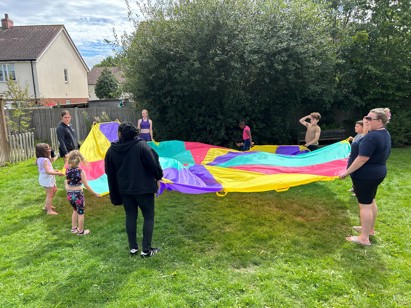 Summer club in Edenbridge - children with a parachute